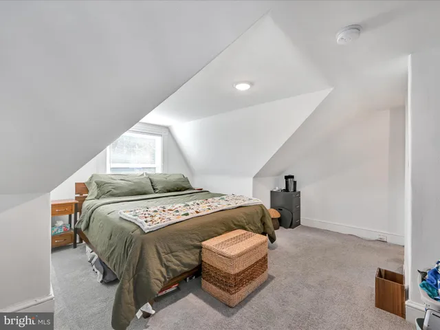 a bedroom with a bed and a cabinets