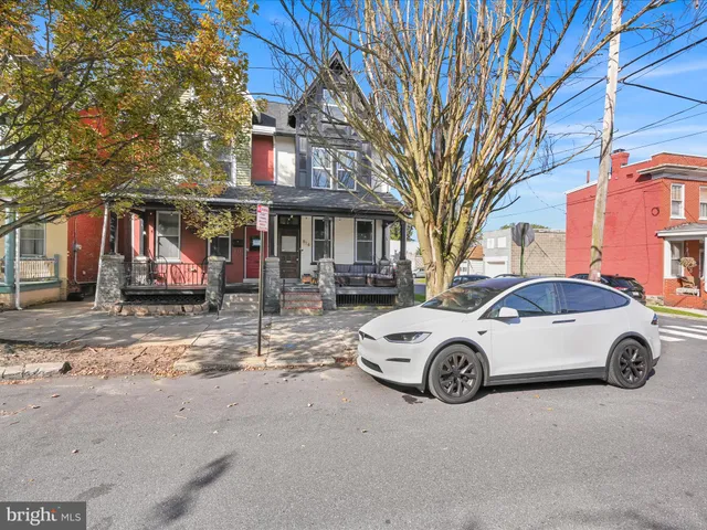a car parked in front of a house
