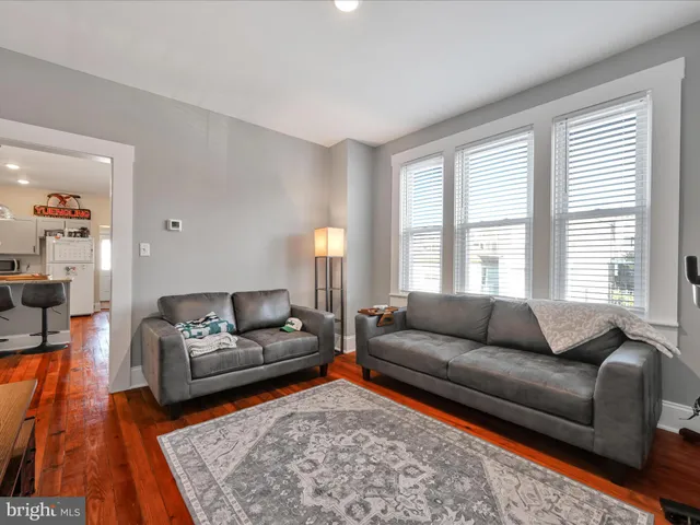a living room with furniture and a rug