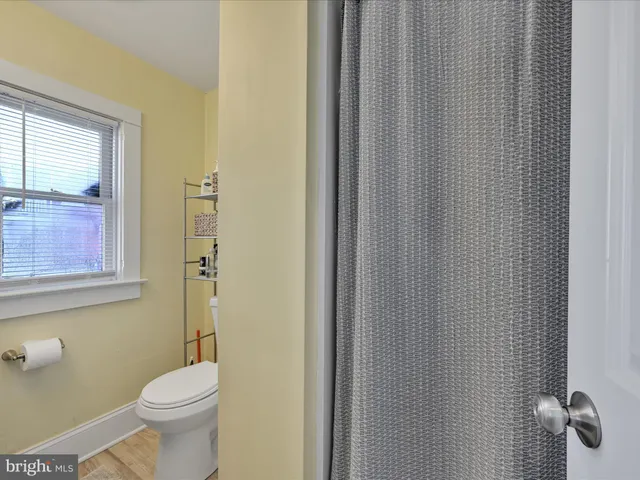 a white toilet sitting next to a bathroom sink