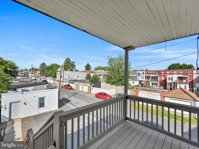 a view of a car parked in front of a building