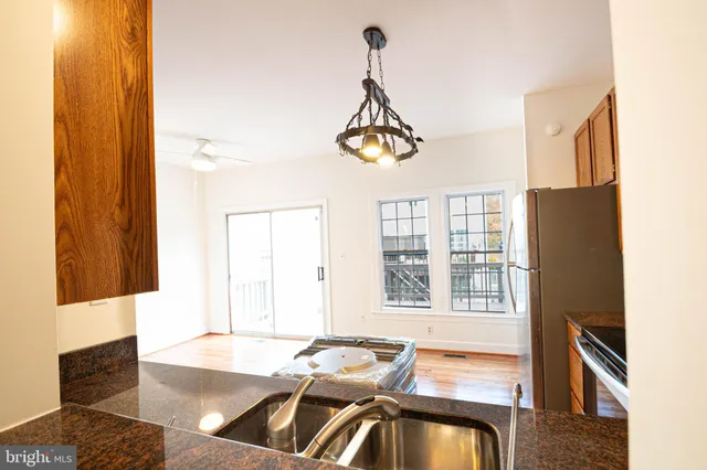 a view of a livingroom with furniture window and wooden floor