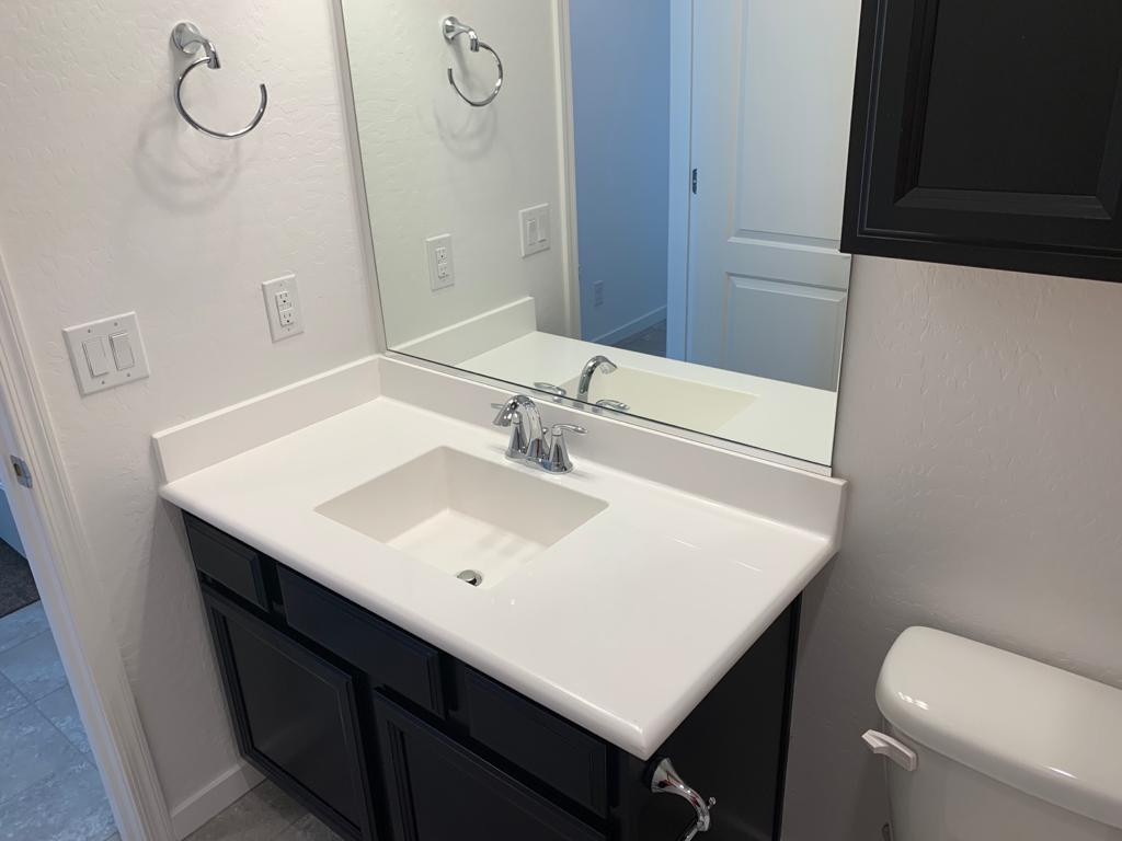 3900 East Baseline Road, Unit 118 Phoenix, AZ 85042 - Photo 9 of 32 a bathroom with a sink and a toilet