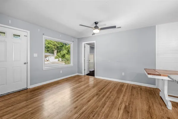 a bed sitting in a room next to a window