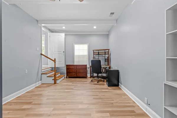 a room with a bed and furniture