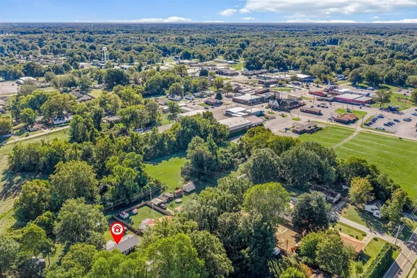 a view of a room with wooden floor and bedroom