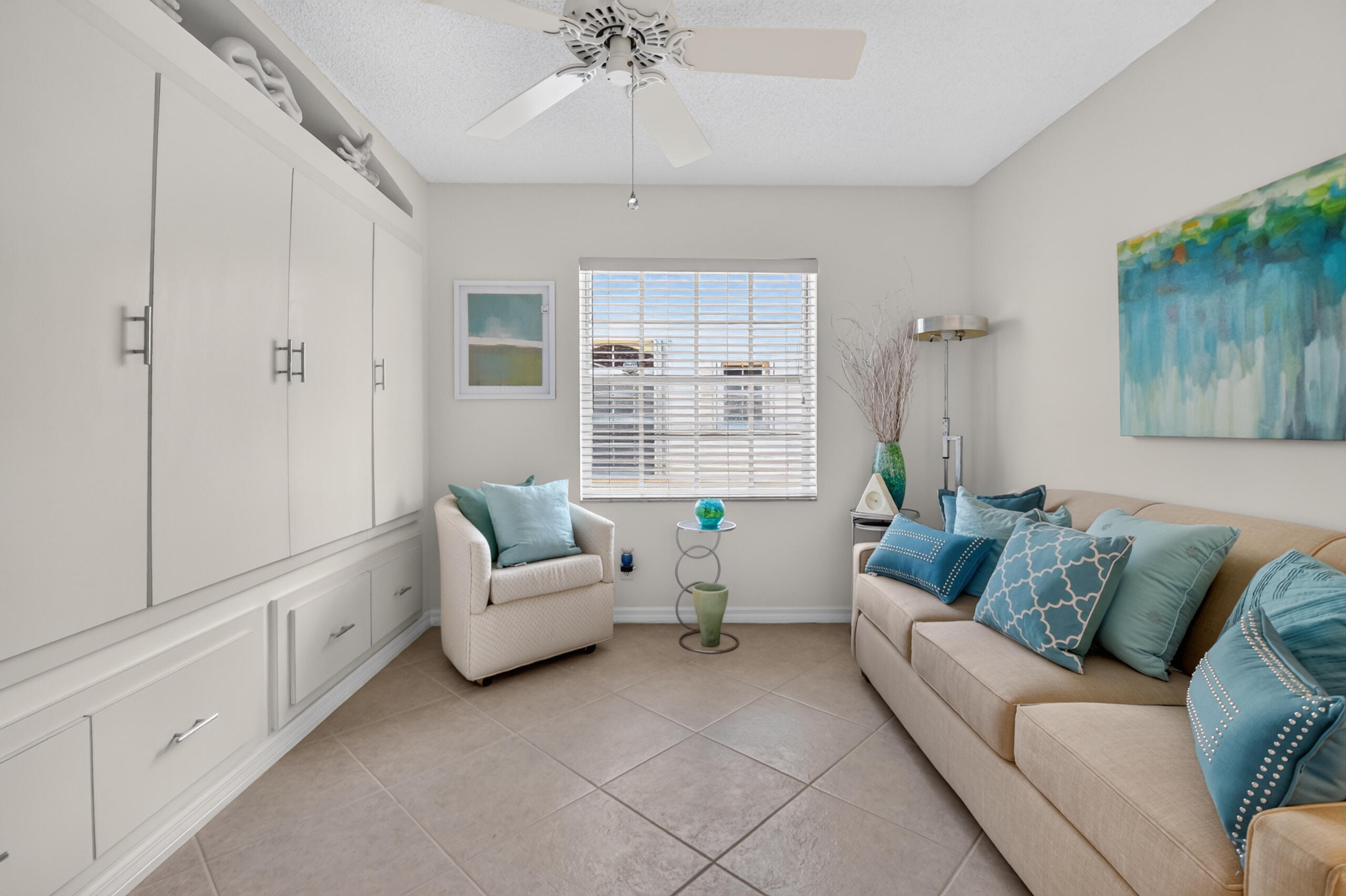 15340 Floral Club Road Delray Beach, FL 33484 - Photo 28 of 42 a living room with furniture and a large window