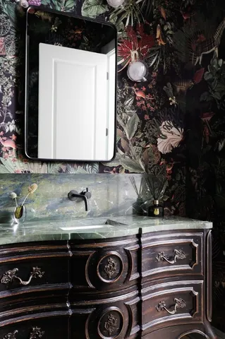 a close view of stove a sink and a microwave oven