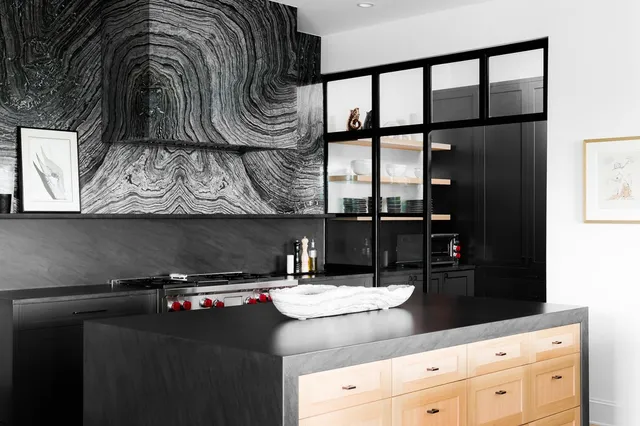 a kitchen with a sink and cabinets