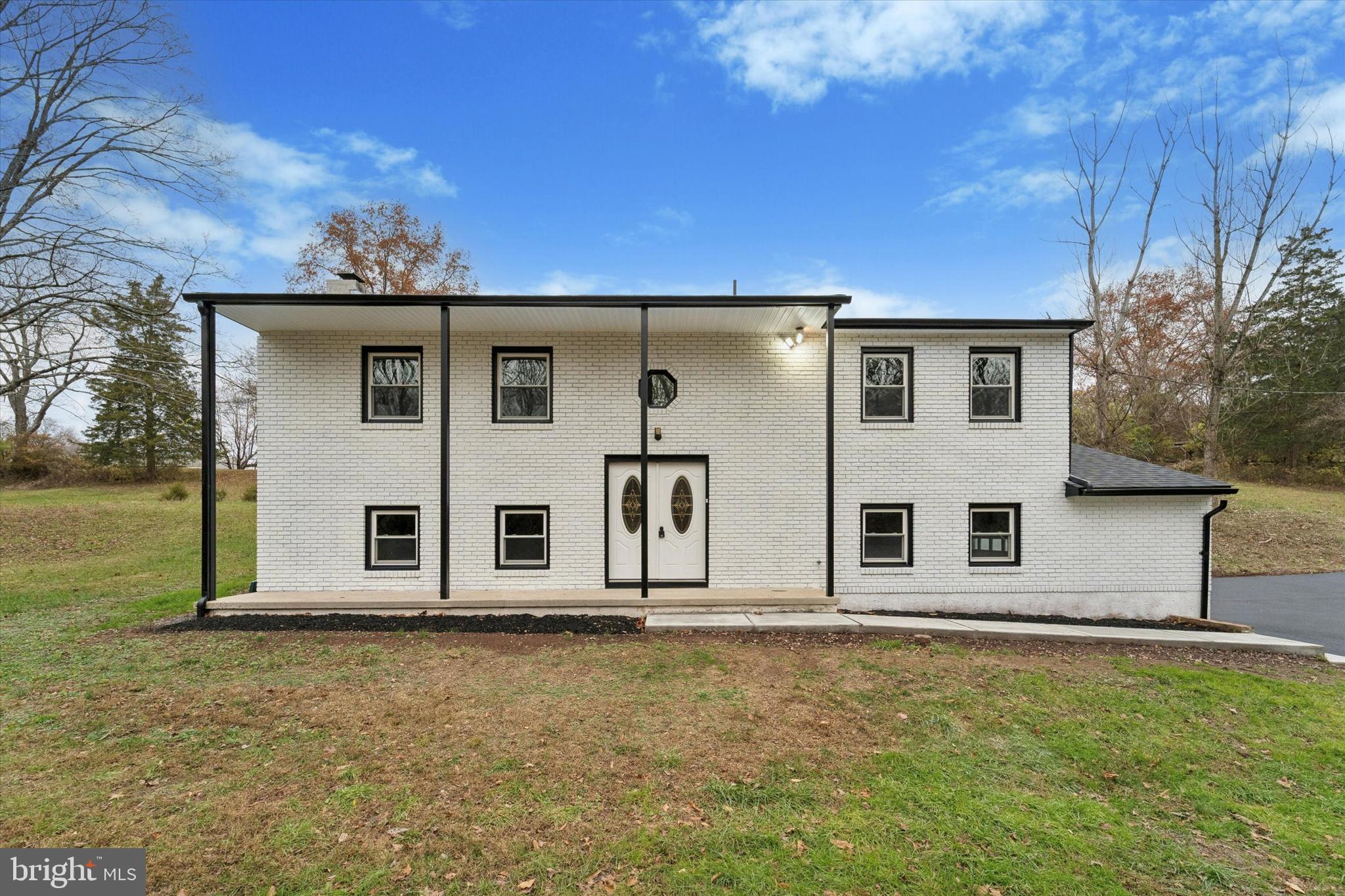 front view of a house with a yard