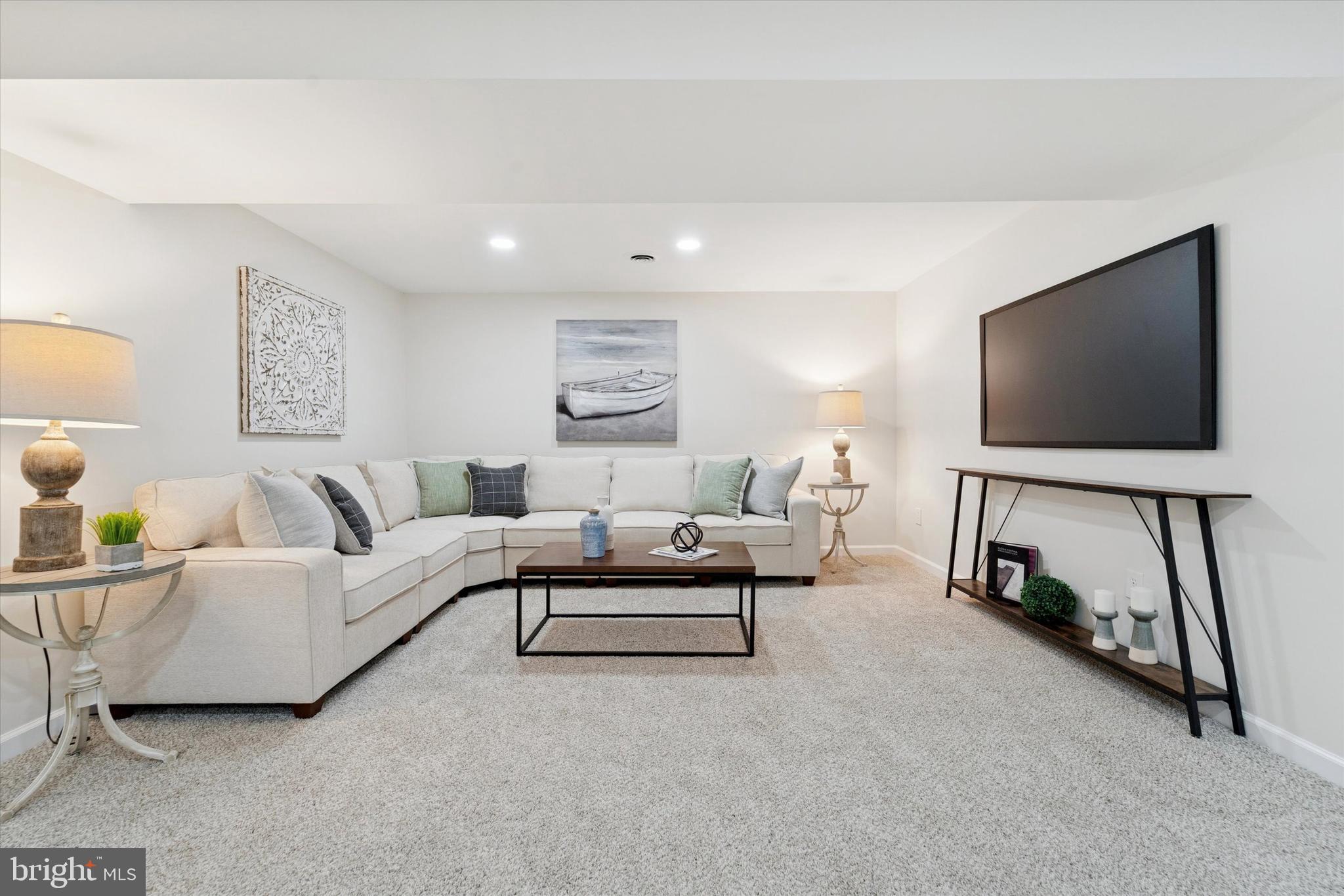 2672 Crownview Road Pottstown, PA 19464 - Photo 15 of 25 a living room with furniture and a flat screen tv