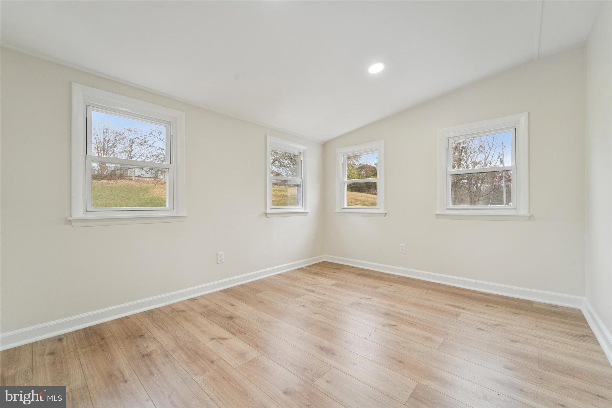 2672 Crownview Road Pottstown, PA 19464 - Photo 21 of 25 a view of empty room with wooden floor and window