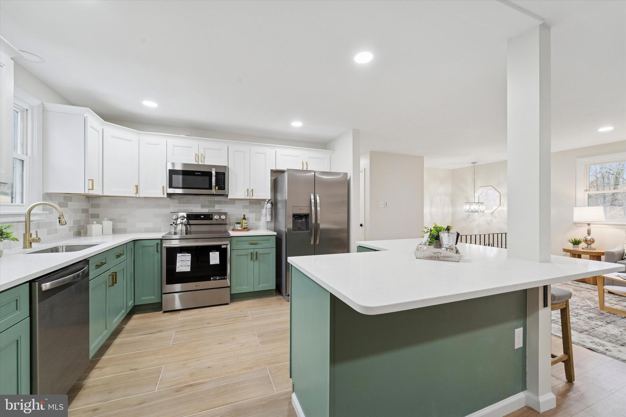 2672 Crownview Road Pottstown, PA 19464 - Photo 8 of 25 a kitchen with kitchen island a sink stainless steel appliances and cabinets