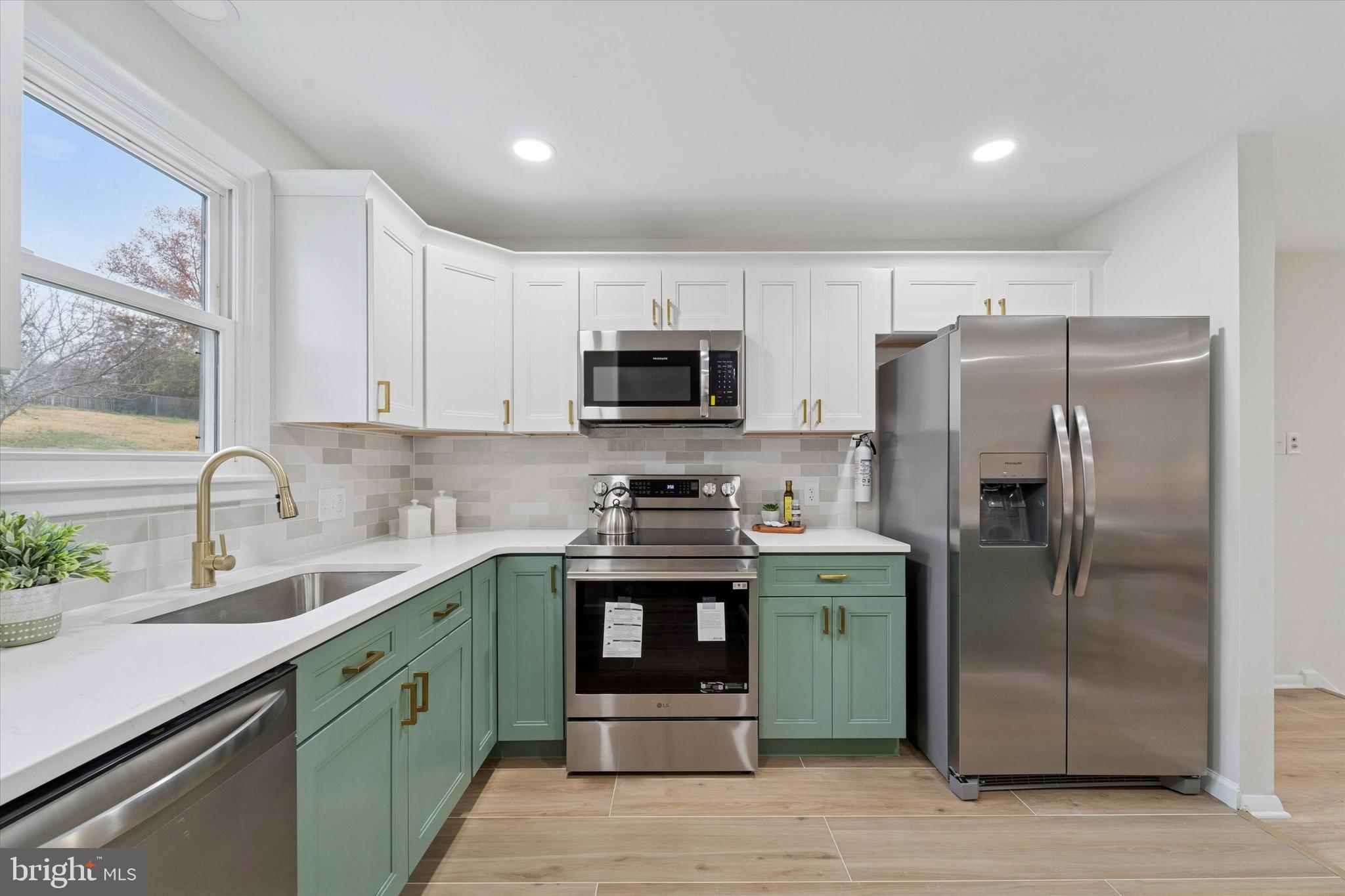 2672 Crownview Road Pottstown, PA 19464 - Photo 9 of 25 a kitchen with stainless steel appliances granite countertop a stove a refrigerator and a sink
