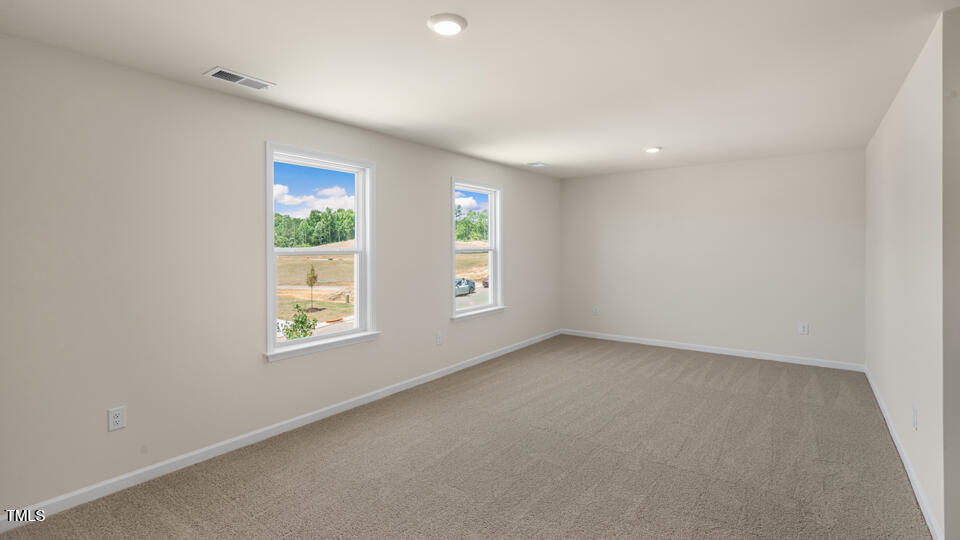 154 Red Jasper Way Clayton, NC 27520 - Photo 15 of 33 an empty room with windows