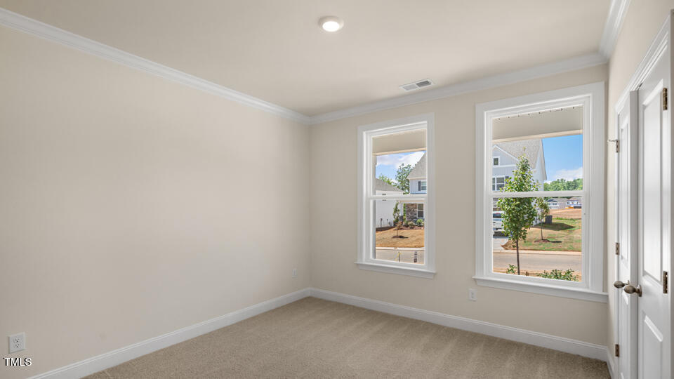 154 Red Jasper Way Clayton, NC 27520 - Photo 22 of 33 an empty room with windows