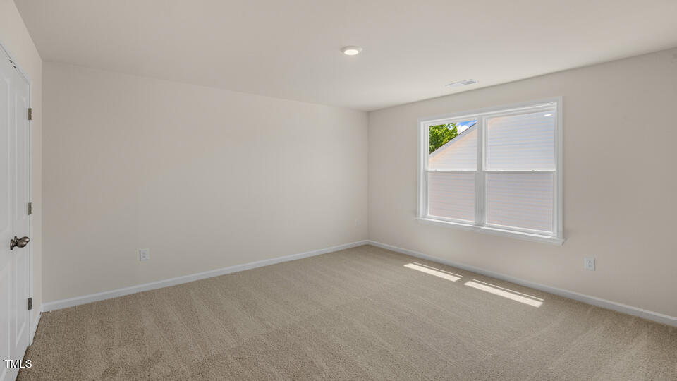 154 Red Jasper Way Clayton, NC 27520 - Photo 24 of 33 an empty room with a window