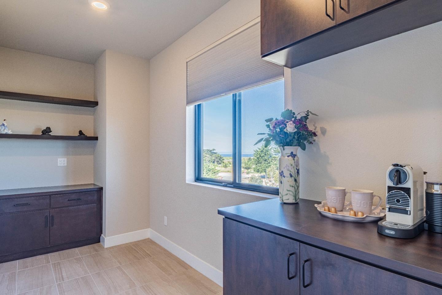 135 8th Street Marina, CA 93933 - Photo 39 of 69 a dining room with wooden floor a potted plant and a window