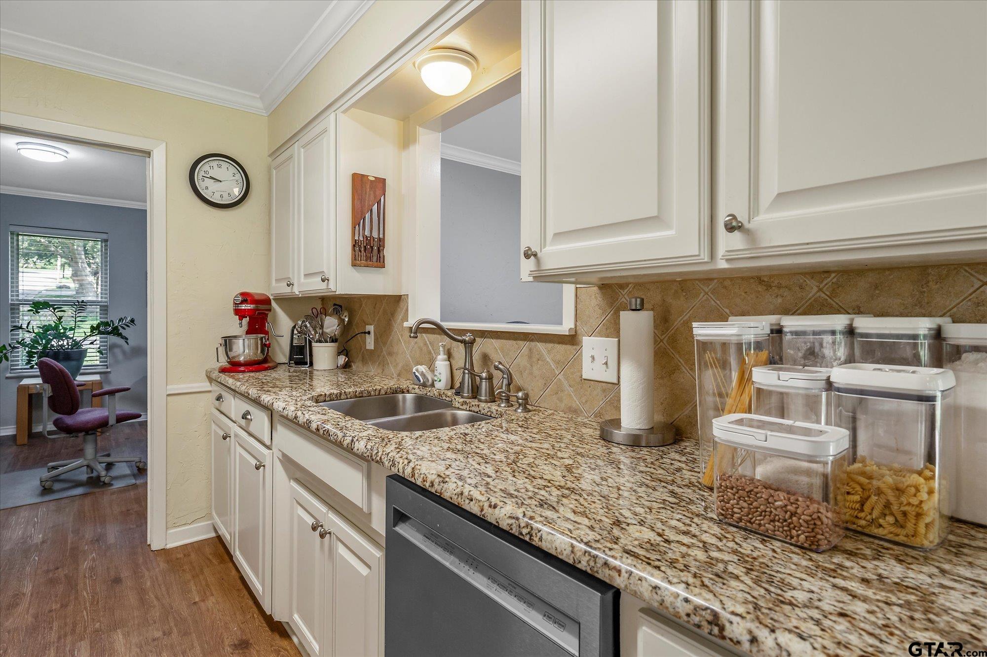3724 Pollard Drive Tyler, TX 75701 - Photo 13 of 28 a kitchen with granite countertop a sink and a stove