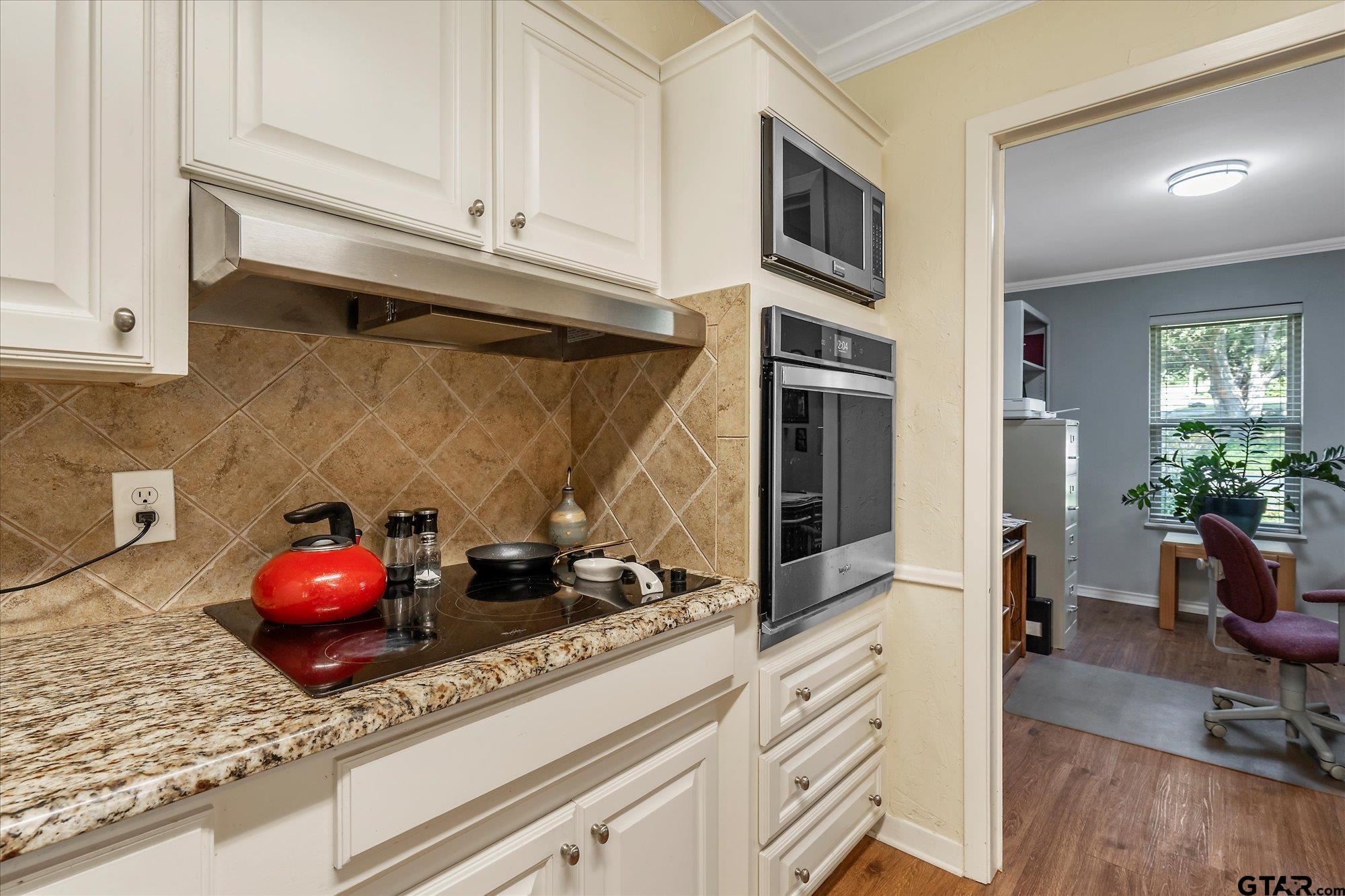 3724 Pollard Drive Tyler, TX 75701 - Photo 14 of 28 a kitchen with a stove and cabinets