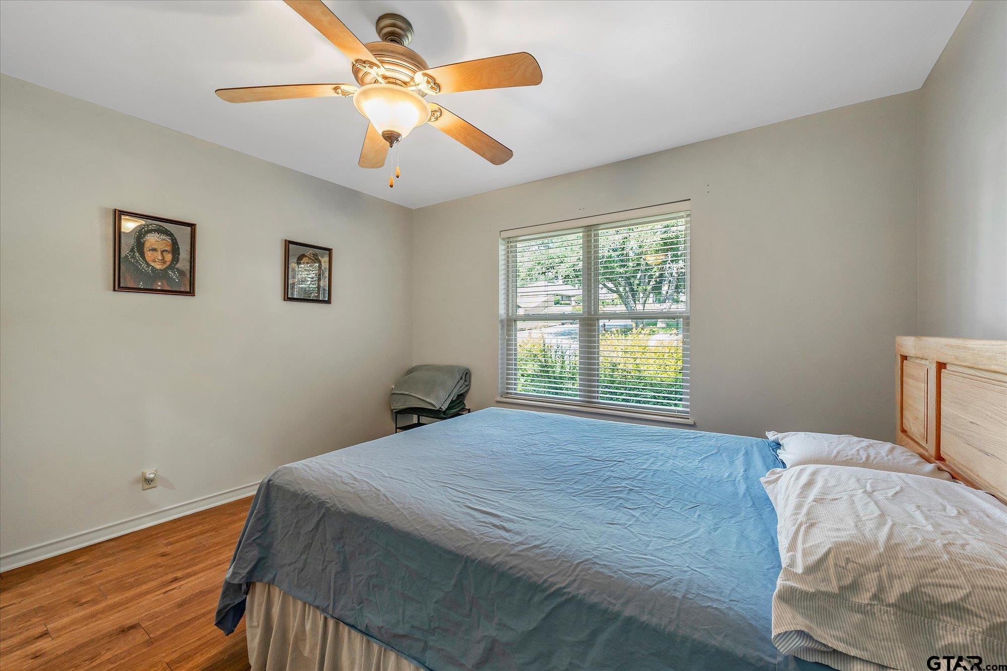 3724 Pollard Drive Tyler, TX 75701 - Photo 20 of 28 a bedroom with a bed and a window
