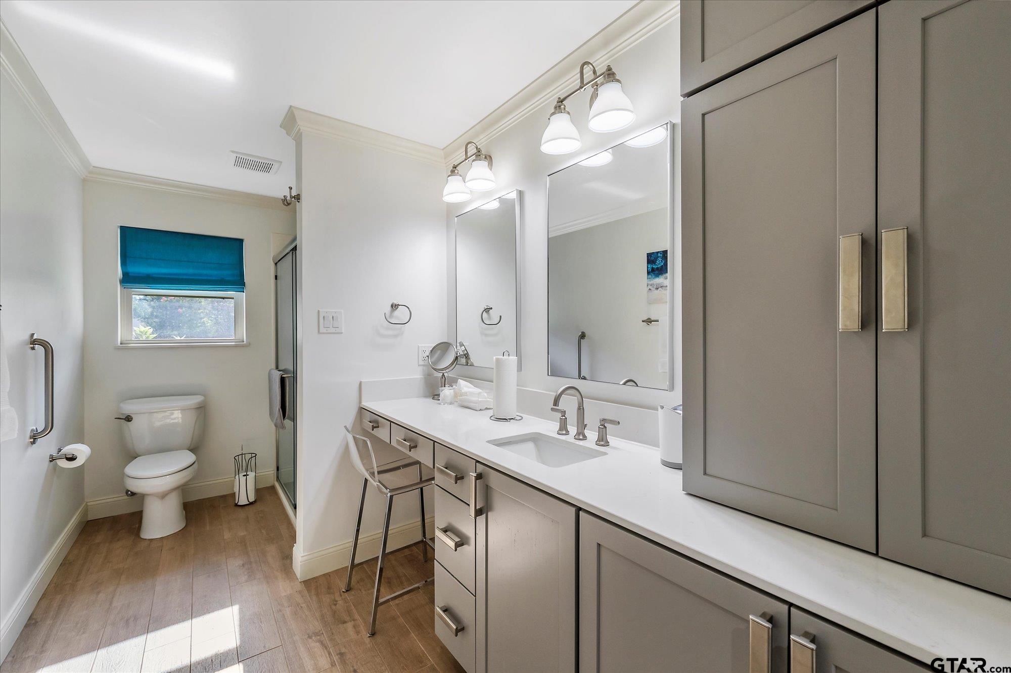 3724 Pollard Drive Tyler, TX 75701 - Photo 21 of 28 a spacious bathroom with a sink a toilet a large mirror and shower