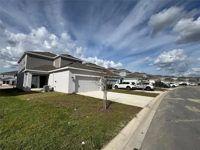 a view of a street with cars on road