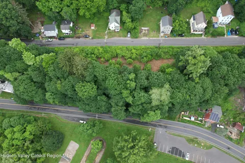 a view of a back yard of the house and front view of a house