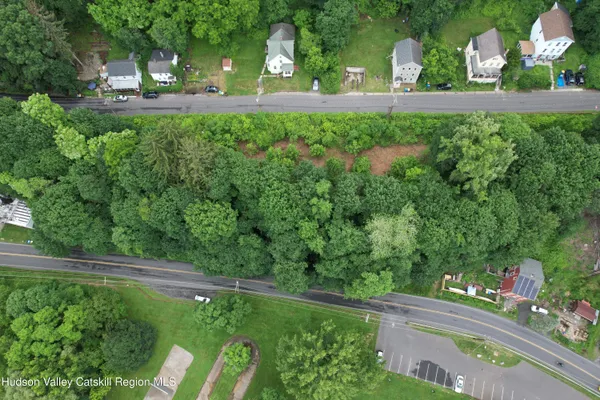 a view of a back yard of the house and front view of a house