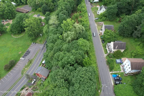 an aerial view of house with yard