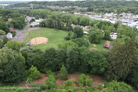an aerial view of a house with yard swimming pool and outdoor seating