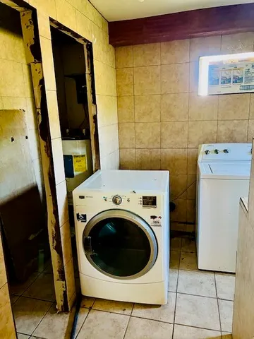 a utility room with dryer and washer