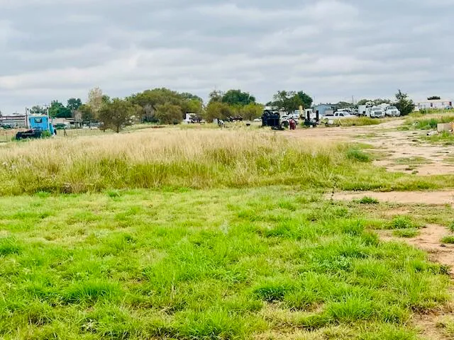 a view of a lake with houses in the back