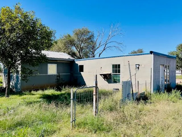 a view of a back yard of the house