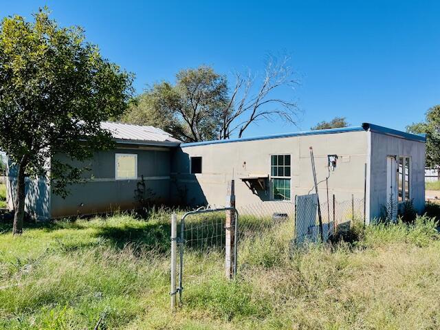 6318 East County Road 6500 Lubbock, TX 79403 - Photo 10 of 17 a view of a back yard of the house