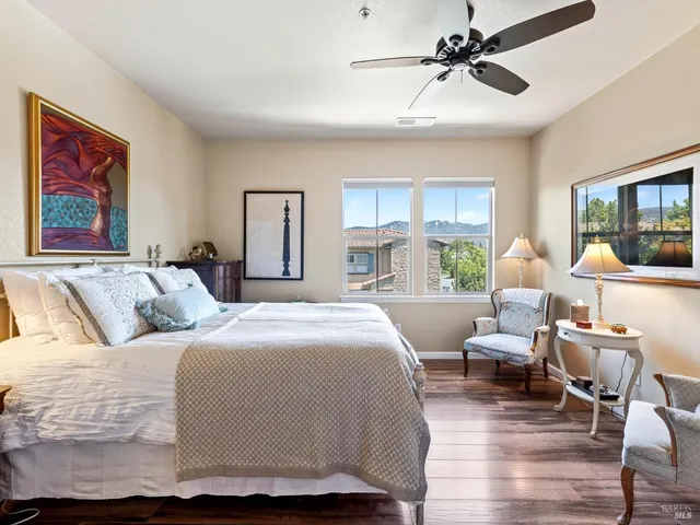 a bedroom with a large bed and a window
