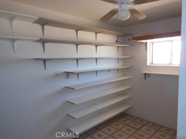 62323 Mars Drive Joshua Tree, CA 92252 - Photo 19 of 26 a view of walk in closet with empty racks
