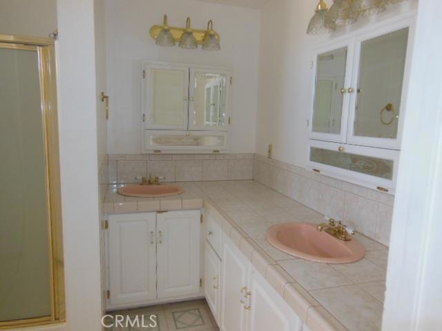 62323 Mars Drive Joshua Tree, CA 92252 - Photo 21 of 26 a bathroom with a sink and a mirror