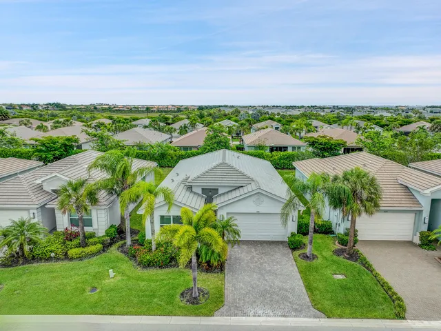 a aerial view of a house with a garden and yard