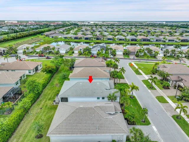 an aerial view of a houses with a yard