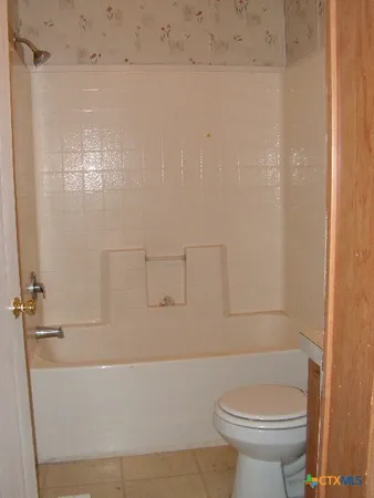 a bathroom with a sink and toilet