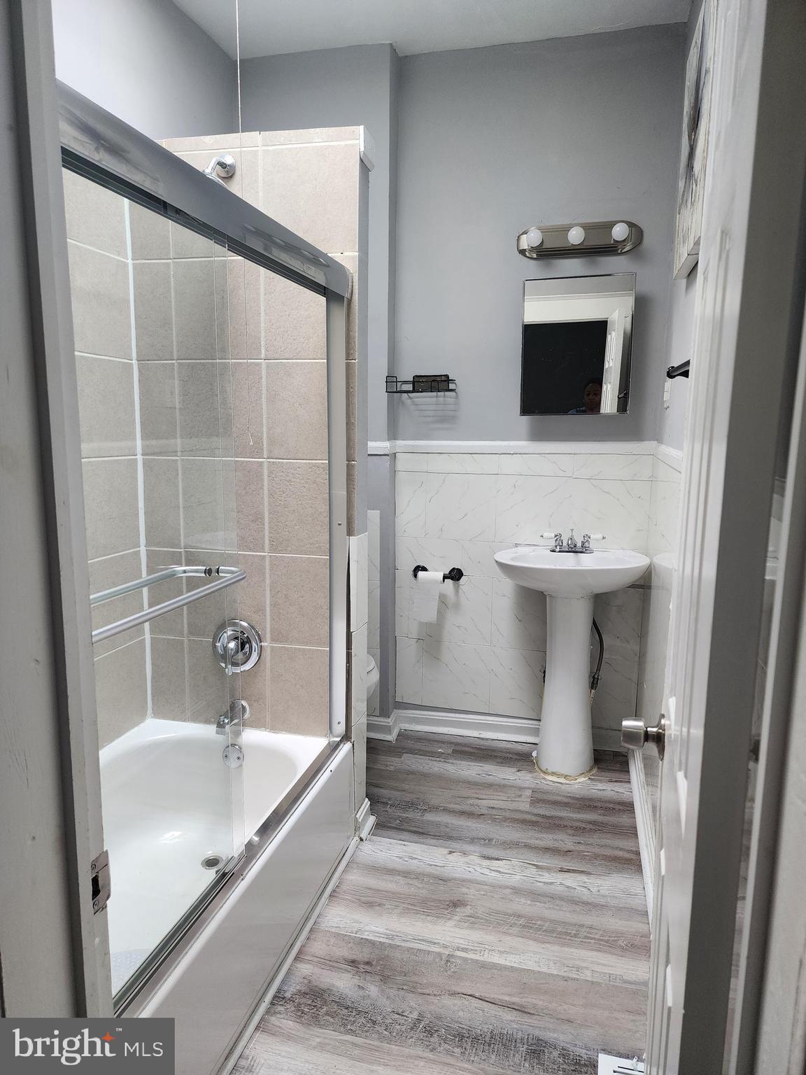 622 Allendale Street Baltimore, MD 21229 - Photo 12 of 29 a bathroom with a sink and mirror