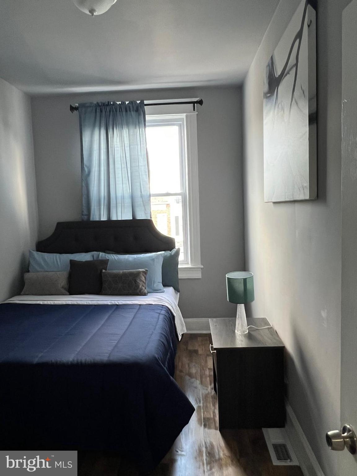 622 Allendale Street Baltimore, MD 21229 - Photo 13 of 29 a bedroom with a bed and window