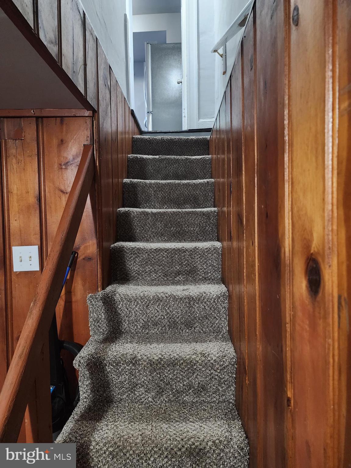 622 Allendale Street Baltimore, MD 21229 - Photo 17 of 29 a view of staircase with lots of frames on wall