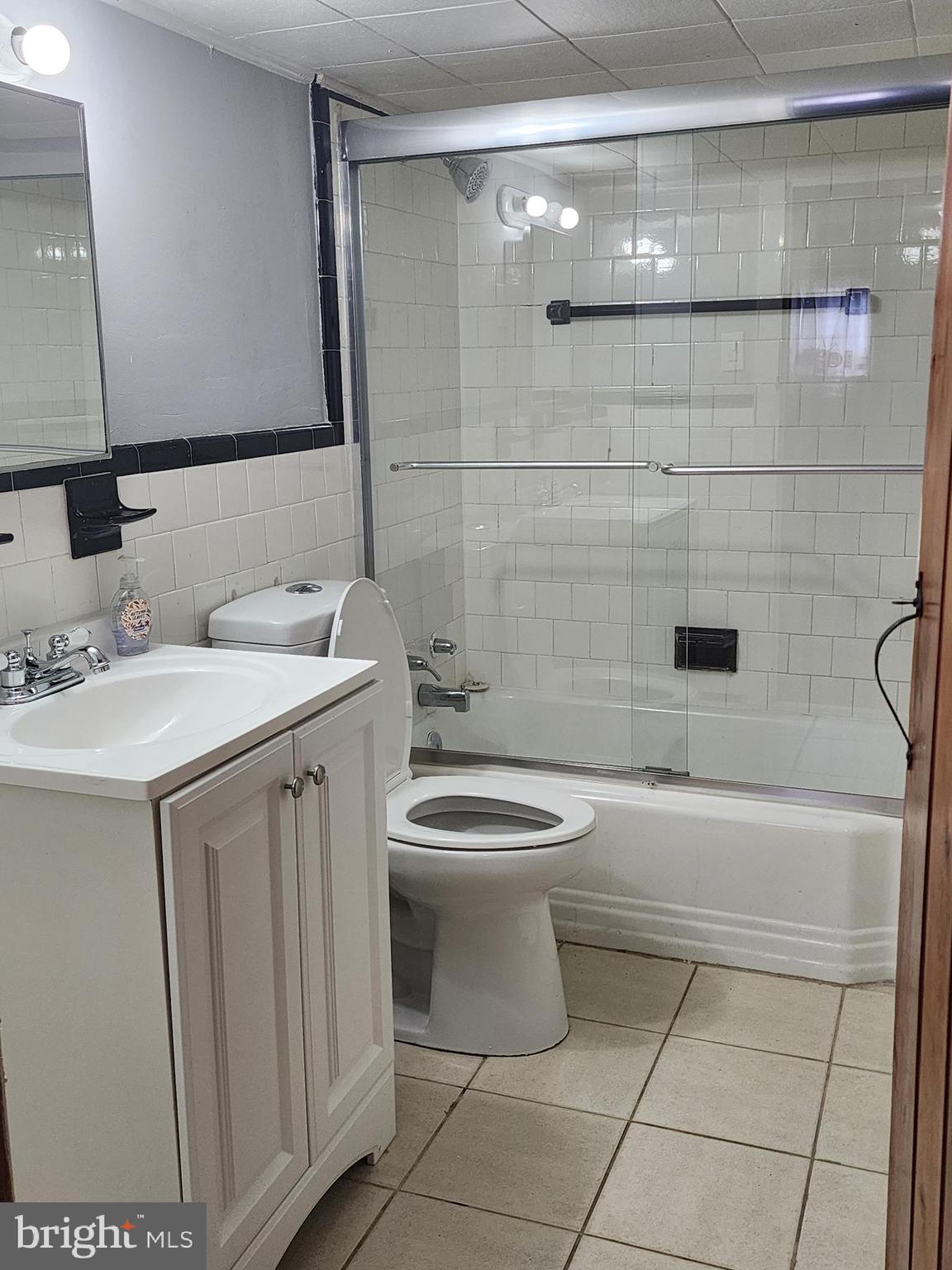 622 Allendale Street Baltimore, MD 21229 - Photo 18 of 29 a bathroom with a sink a toilet and shower