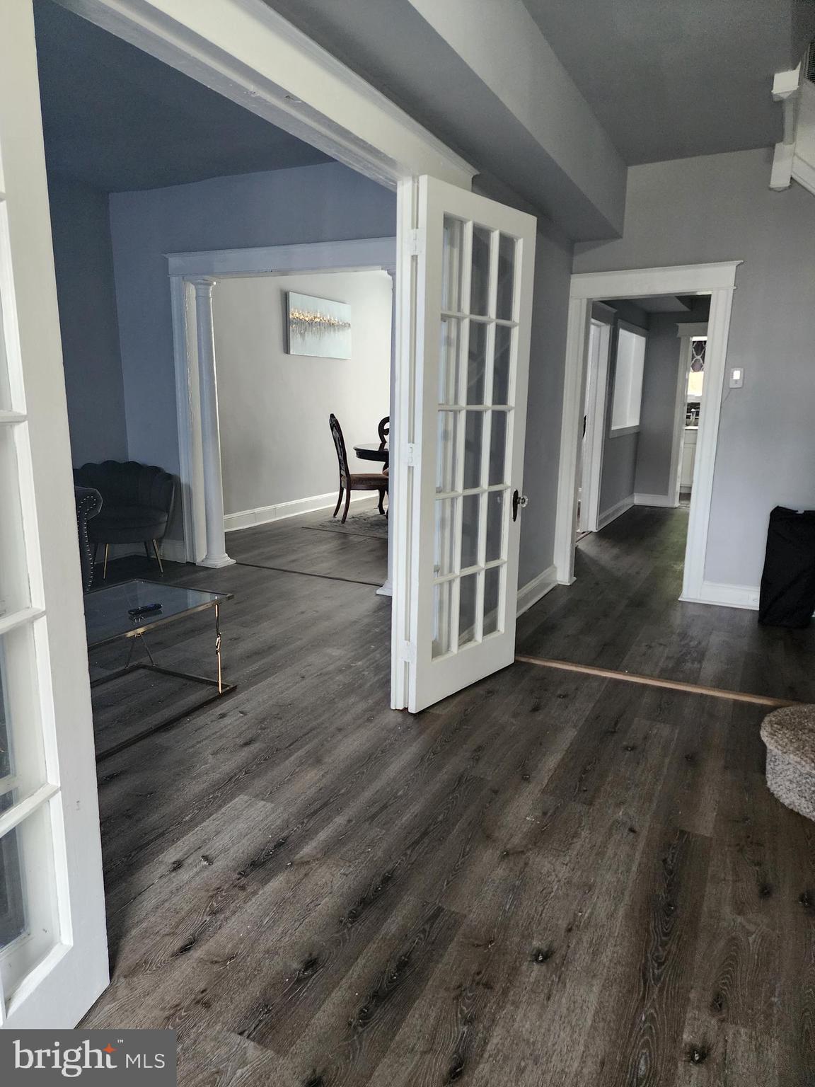 622 Allendale Street Baltimore, MD 21229 - Photo 2 of 29 a view of a hallway with wooden floor and livingroom view