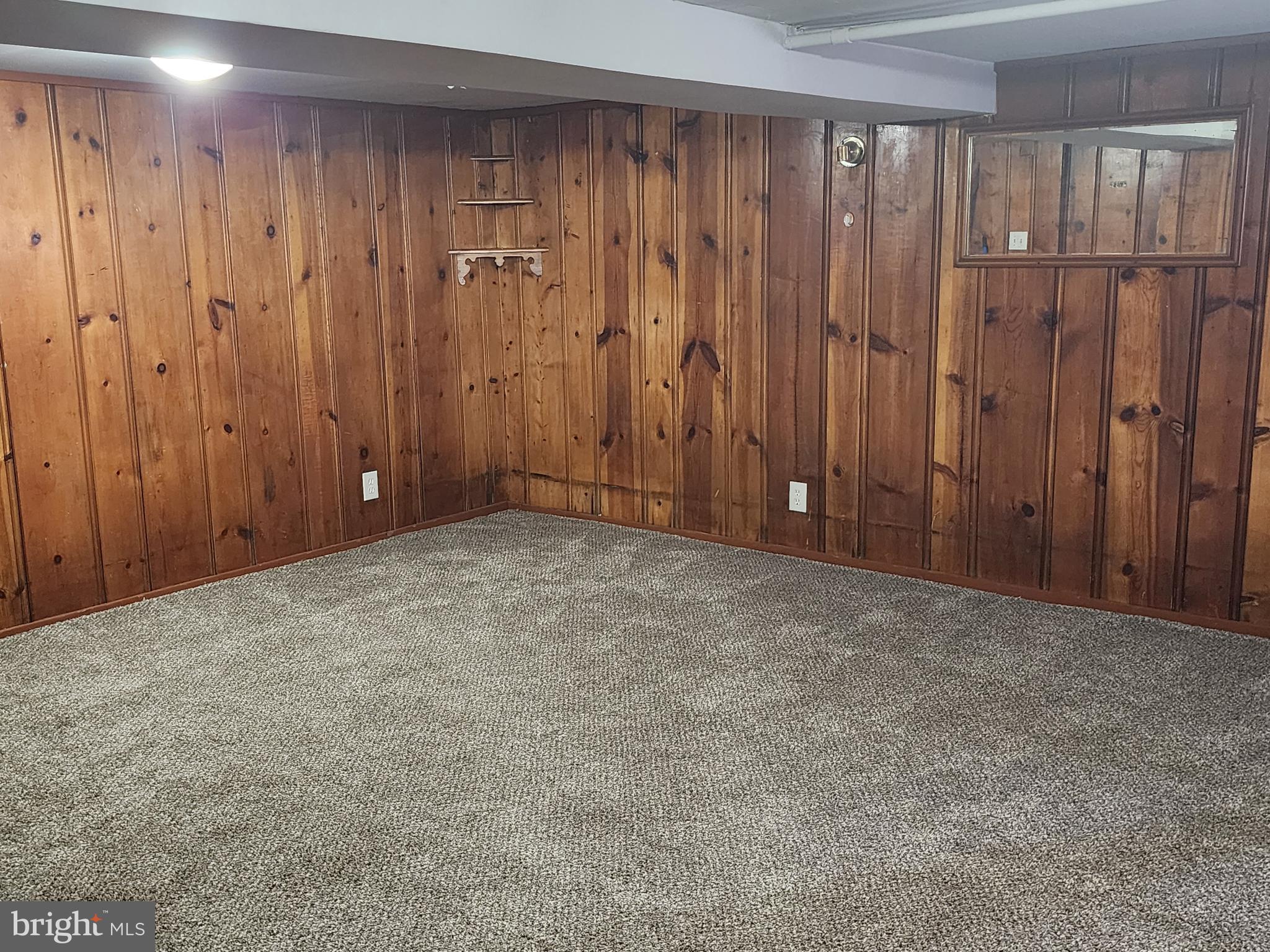 622 Allendale Street Baltimore, MD 21229 - Photo 21 of 29 a view of an empty room with wooden walls