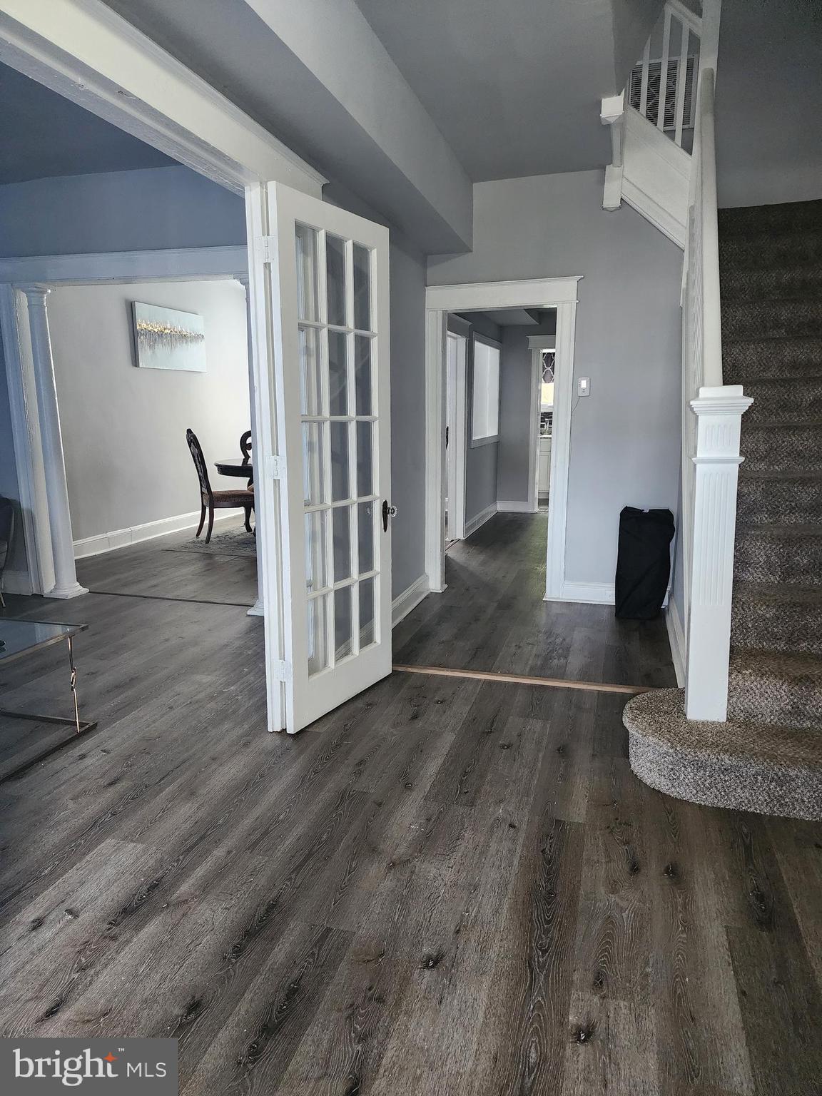 622 Allendale Street Baltimore, MD 21229 - Photo 27 of 29 a view of a hallway with wooden floor and a fireplace