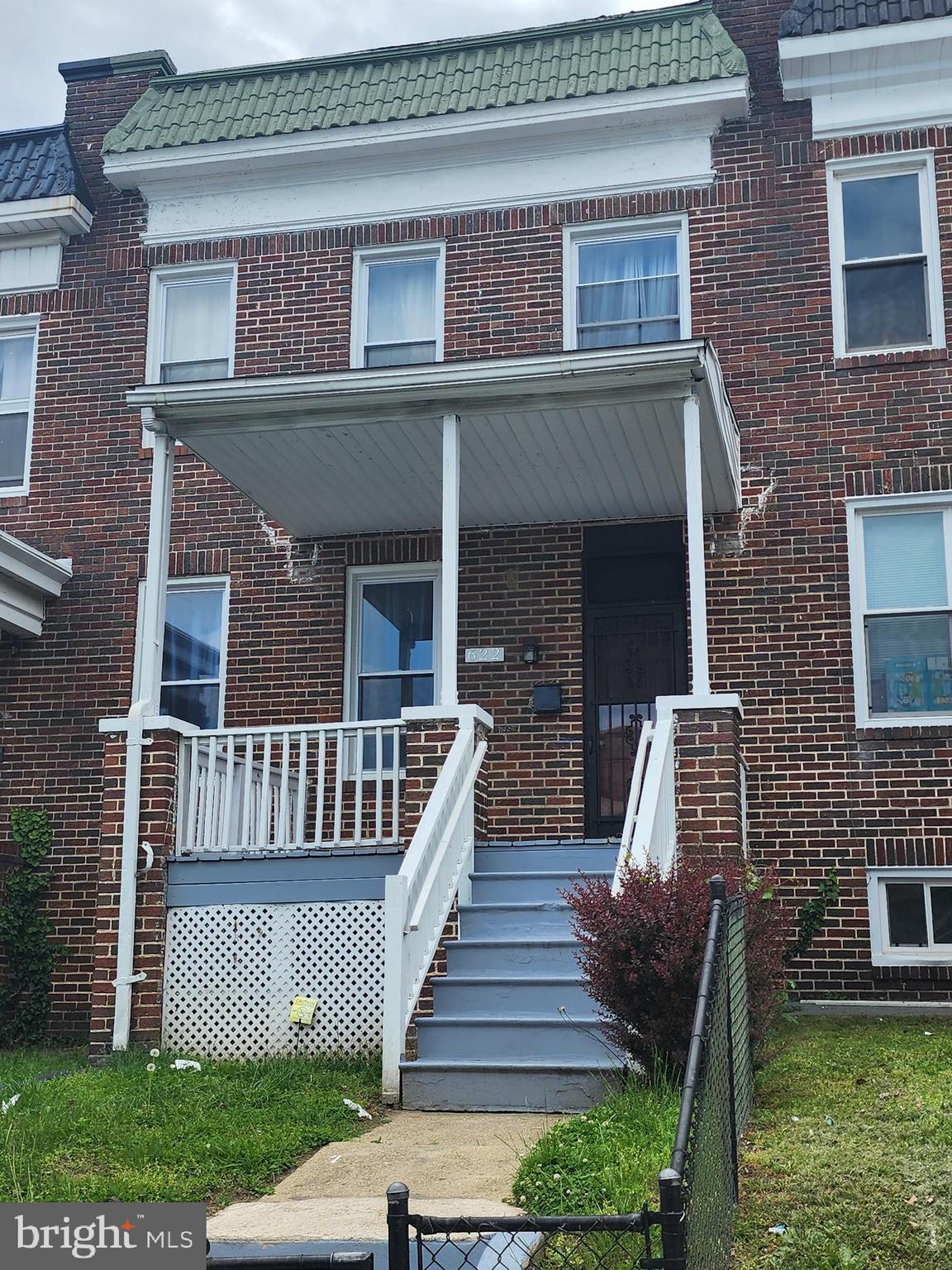 622 Allendale Street Baltimore, MD 21229 - Photo 28 of 29 a front view of a house with garden and deck