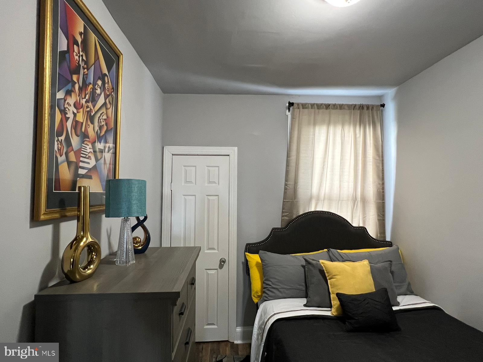 622 Allendale Street Baltimore, MD 21229 - Photo 10 of 29 a bed room with a bed and a chair